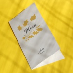 Karty menu na przyjęcie z żółtymi listkami- okładka
