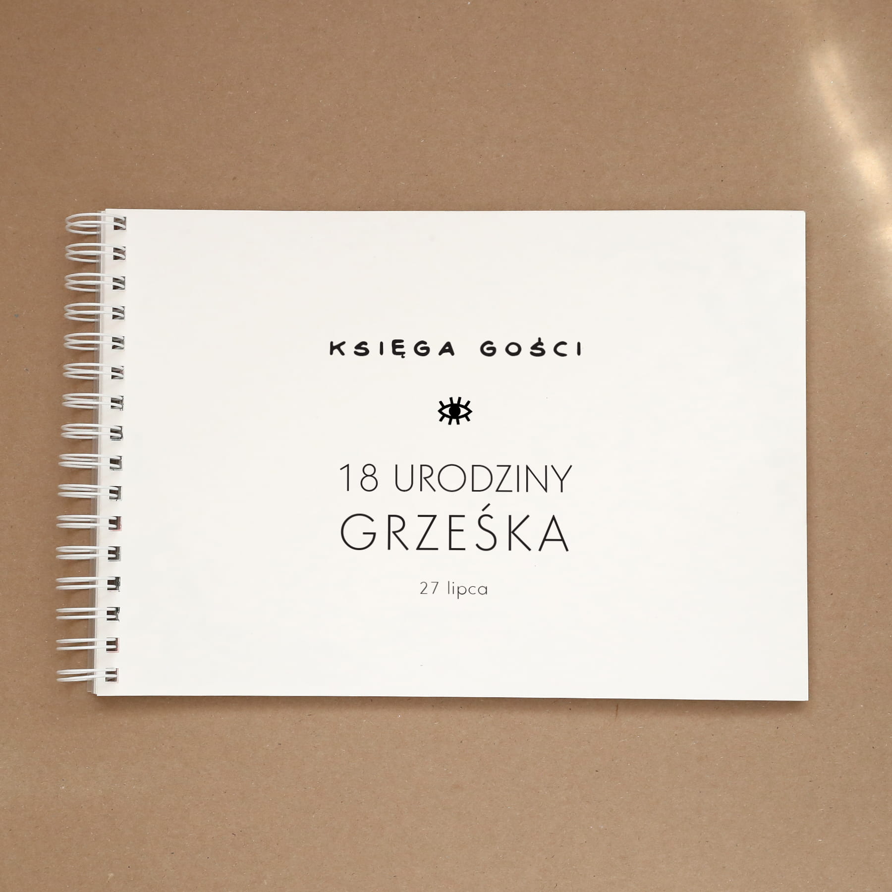 Księga gości z oczkiem na przyjęcie urodzinowe - okładka z przodu